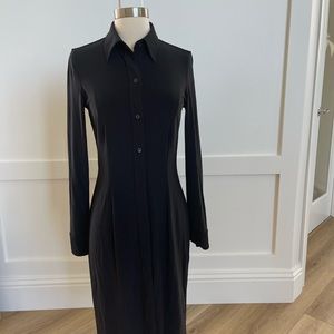 The beautiful black dress with buttons on the front.